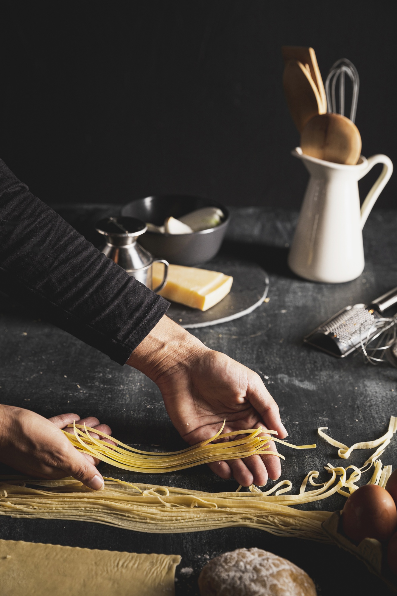 Hand rolling fresh pasta in studio